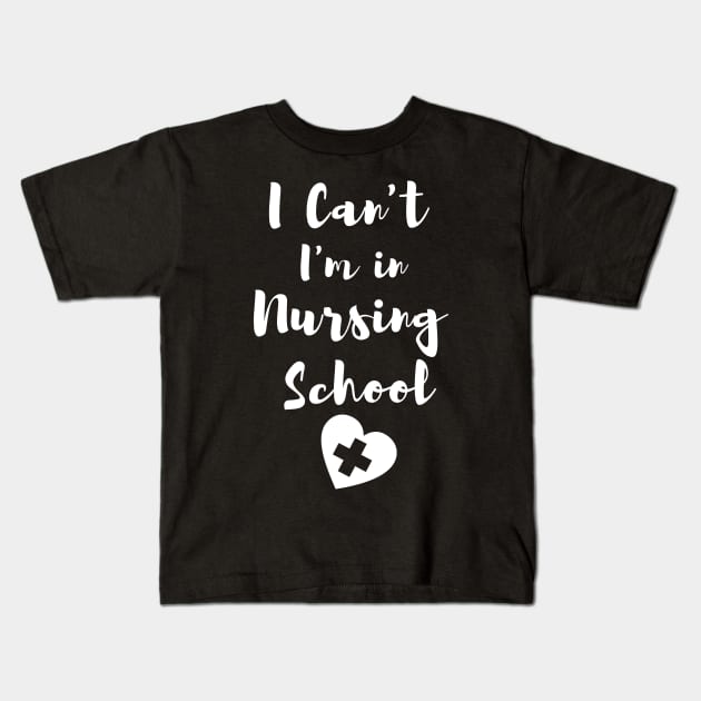 I Can't I'm in Nursing School in White text with heart design Kids T-Shirt by BlueLightDesign